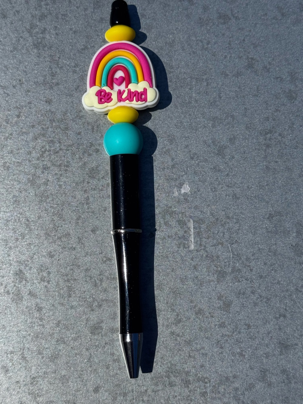 Be Kind Rainbow Decorative Black Pen with Turquoise and Yellow Accents